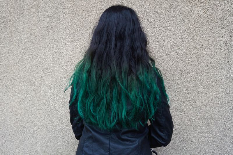 woman with dark green tips
