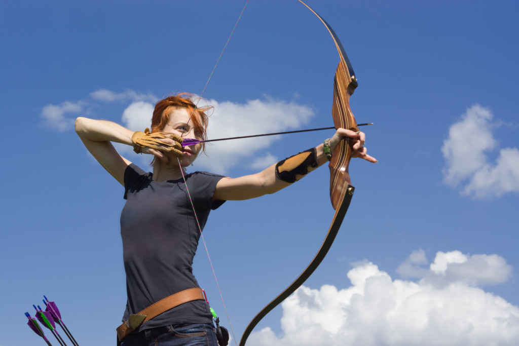 woman aiming an arrow